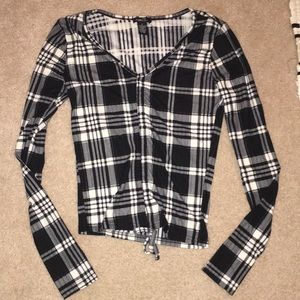 Girls S plaid shirt with decorative bow in front.
